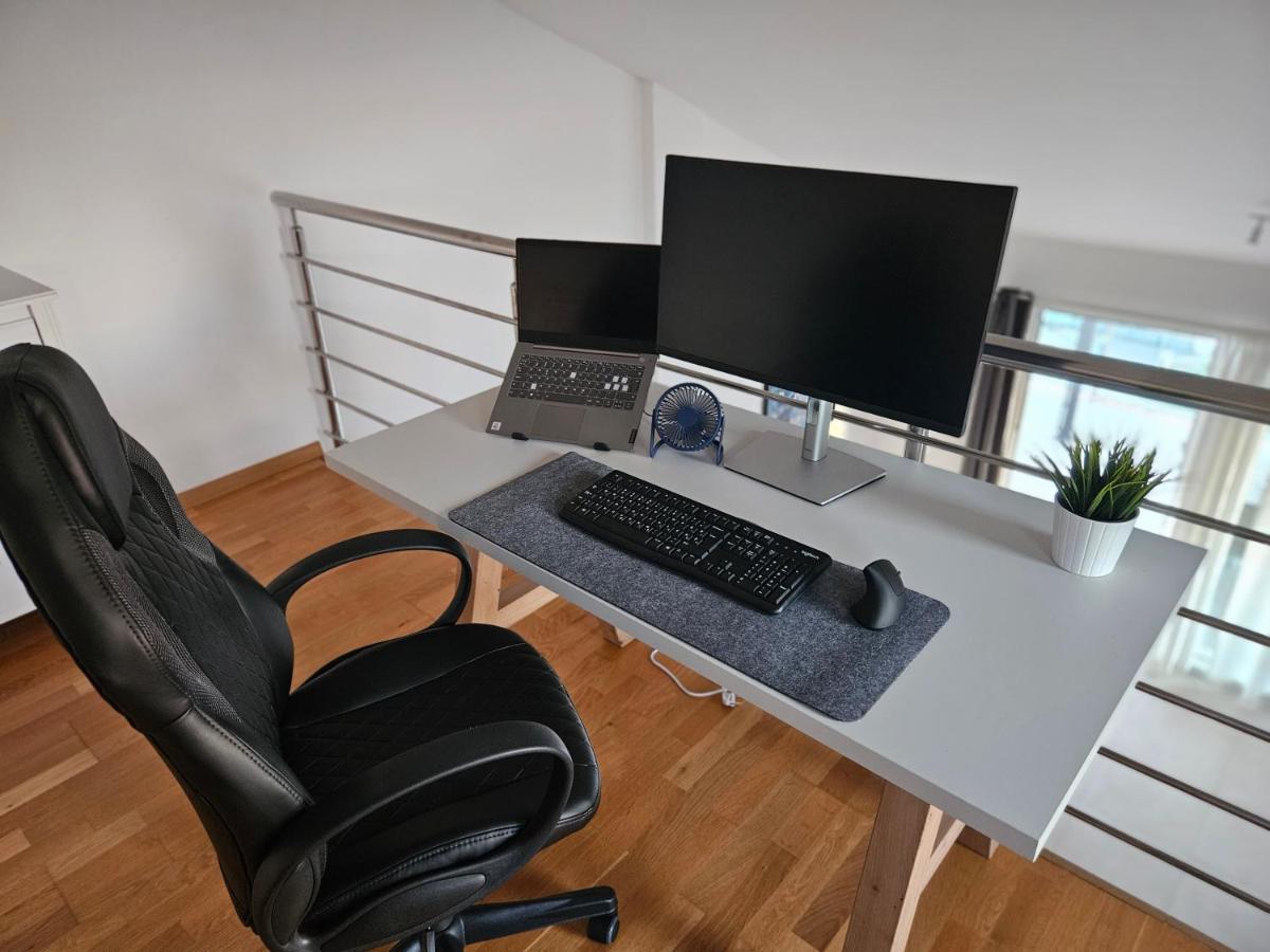 Work desk with monitor, keyboard, and mouse